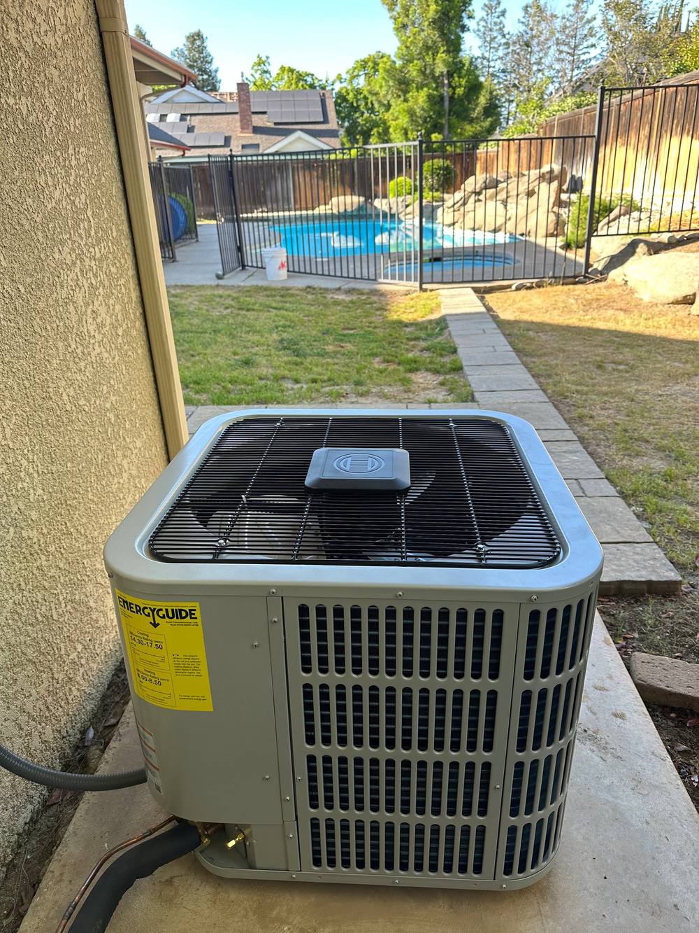 Residential AC unit installed by Impeccable Heating & Cooling